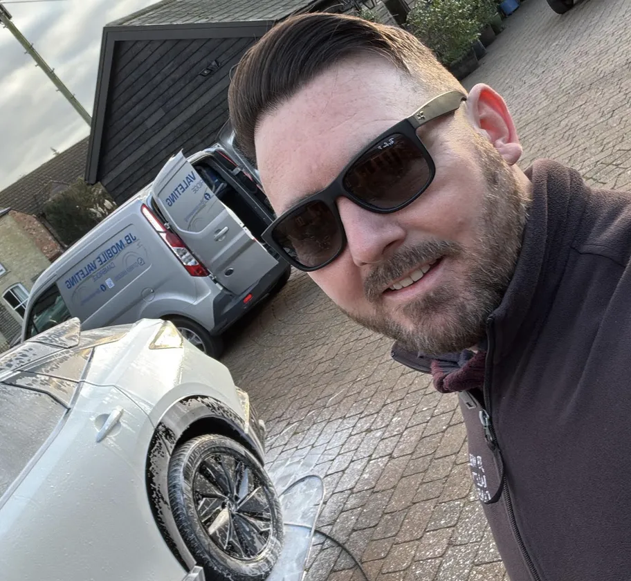 Jonathan Baldwin with his van and a freshly cleaned car